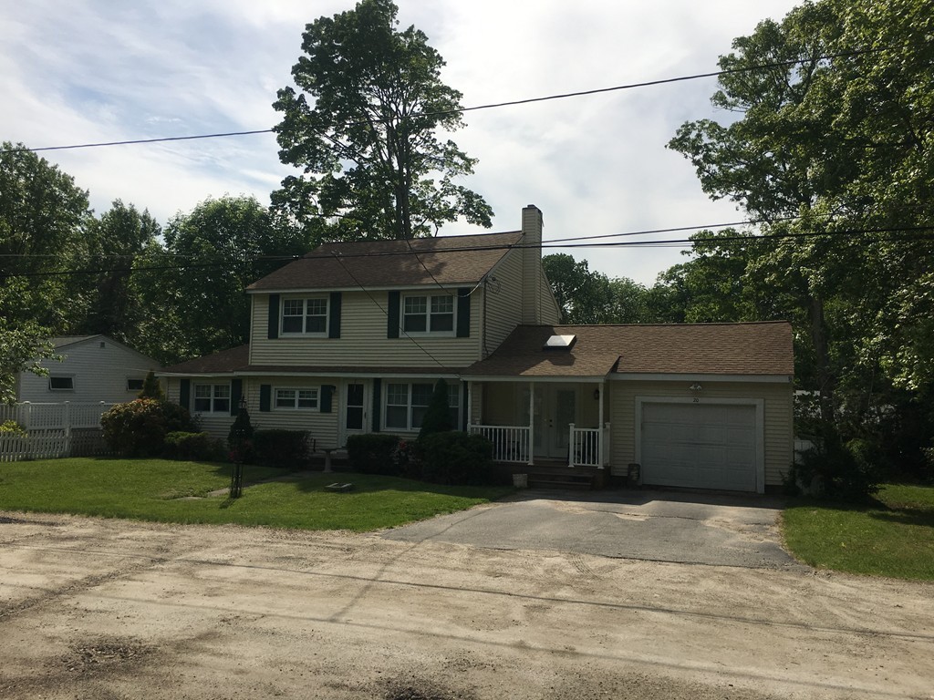 20 Arnold Road Douglas, MA 01516 - Photo 2 of 21 a front view of a house with a yard and garage