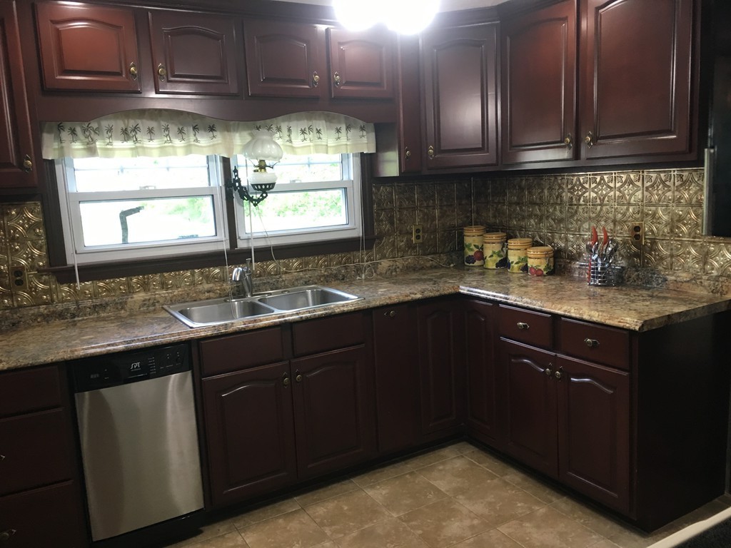 20 Arnold Road Douglas, MA 01516 - Photo 4 of 21 a kitchen with a sink a window and cabinets