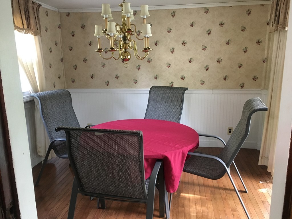 20 Arnold Road Douglas, MA 01516 - Photo 6 of 21 a view of a dining room with furniture and chandelier