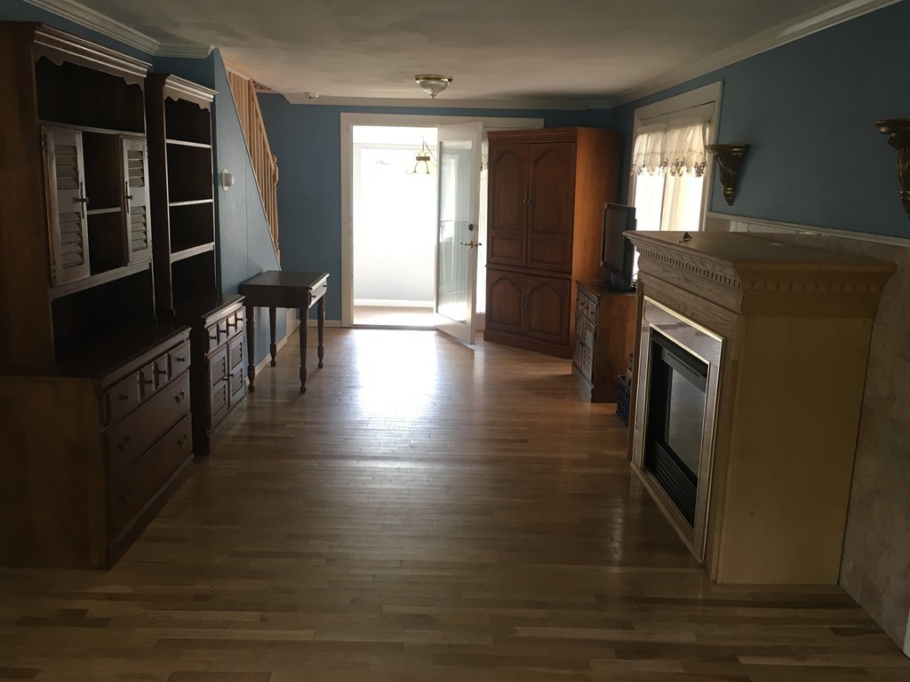 20 Arnold Road Douglas, MA 01516 - Photo 8 of 21 a view of a hallway with wooden floor and stairs