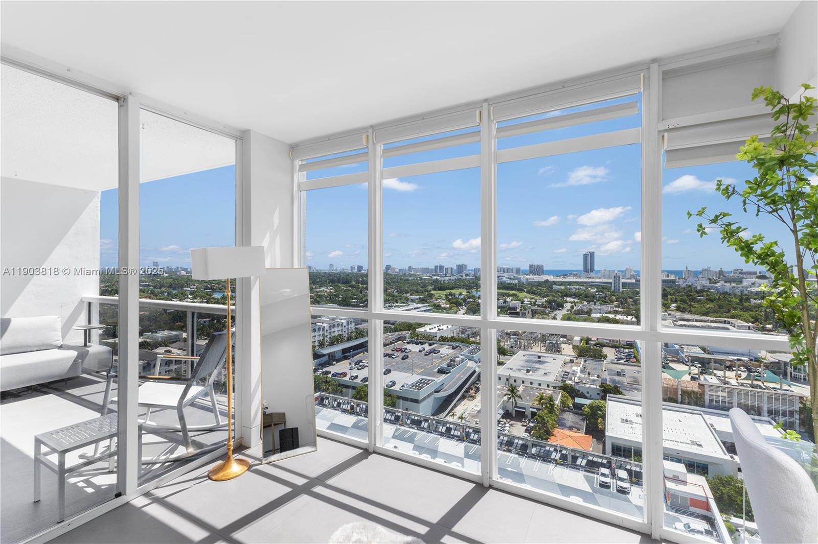 1800 Sunset Harbour Drive, Unit 2105 Miami Beach, FL 33139 - Photo 16 of 52 a view of a city from a living room filled with furniture