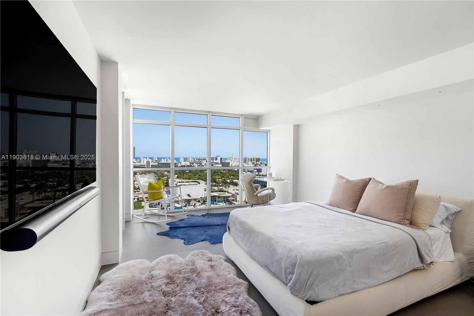 1800 Sunset Harbour Drive, Unit 2105 Miami Beach, FL 33139 - Photo 19 of 52 a bedroom with a bed window and walk in closet with wooden floor
