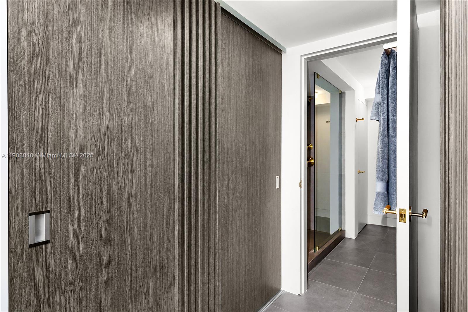 1800 Sunset Harbour Drive, Unit 2105 Miami Beach, FL 33139 - Photo 21 of 52 a view of a hallway with a wooden door