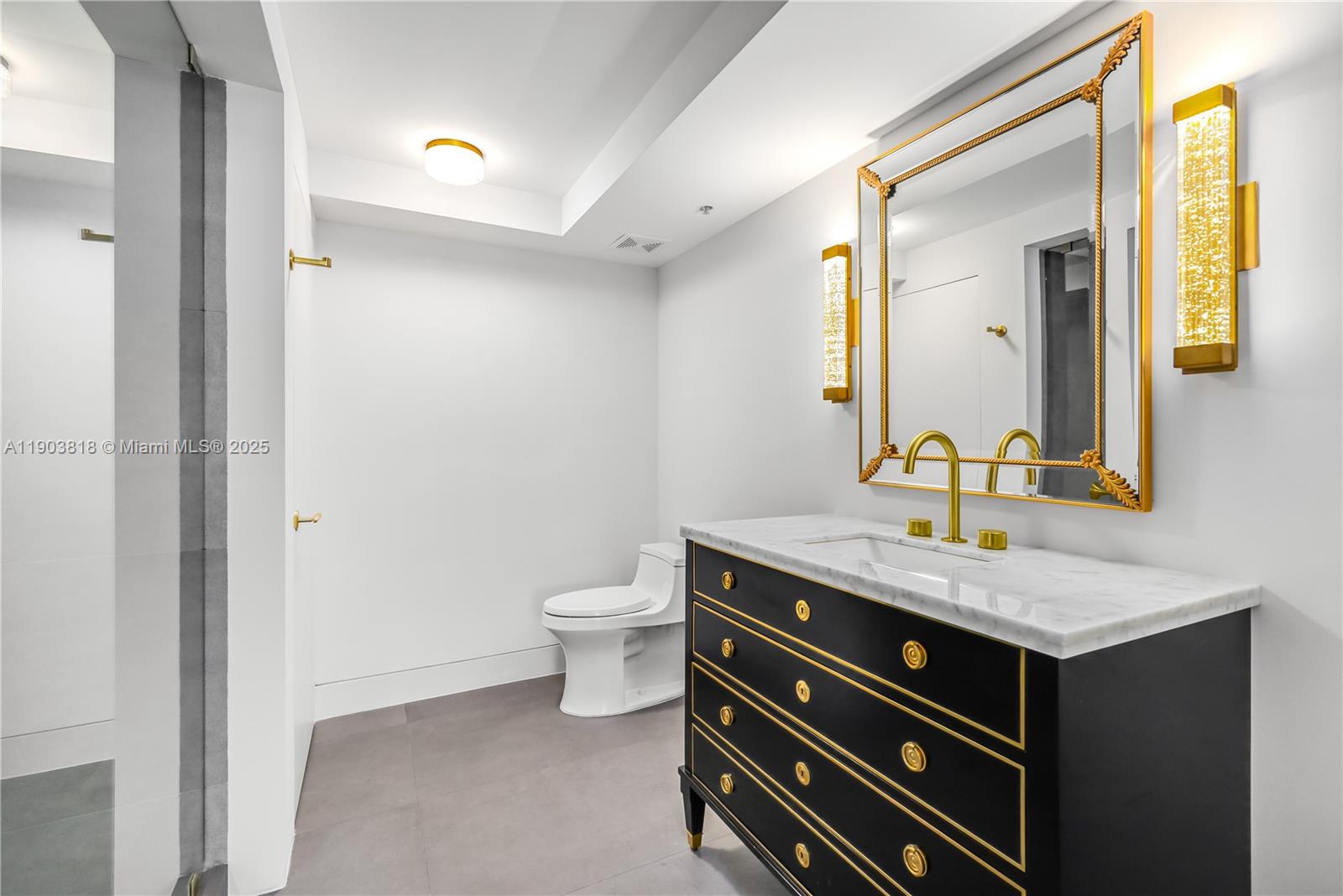 1800 Sunset Harbour Drive, Unit 2105 Miami Beach, FL 33139 - Photo 22 of 52 a bathroom with a granite countertop sink and a mirror