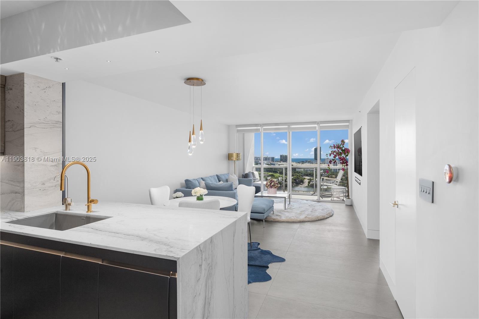 1800 Sunset Harbour Drive, Unit 2105 Miami Beach, FL 33139 - Photo 6 of 52 a kitchen with a sink and a stove top oven