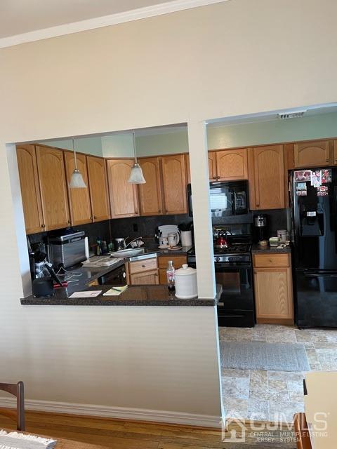 83 Brandywine Road Fords, NJ 08863 - Photo 12 of 31 a kitchen with stainless steel appliances granite countertop a refrigerator a stove and a sink with wooden cabinets