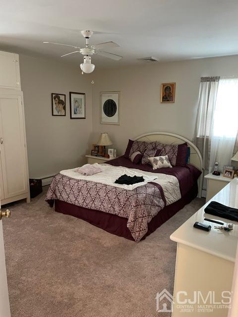 83 Brandywine Road Fords, NJ 08863 - Photo 15 of 31 a bedroom with a bed and a chandelier