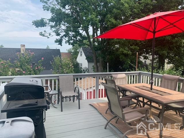 83 Brandywine Road Fords, NJ 08863 - Photo 8 of 31 a view of a balcony with wooden floor and outdoor seating