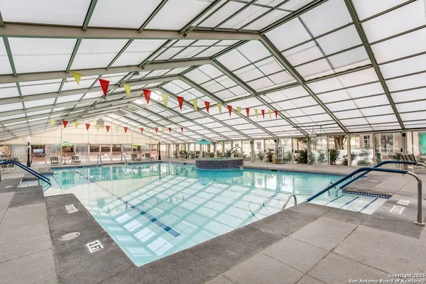 a view of a swimming pool with a patio