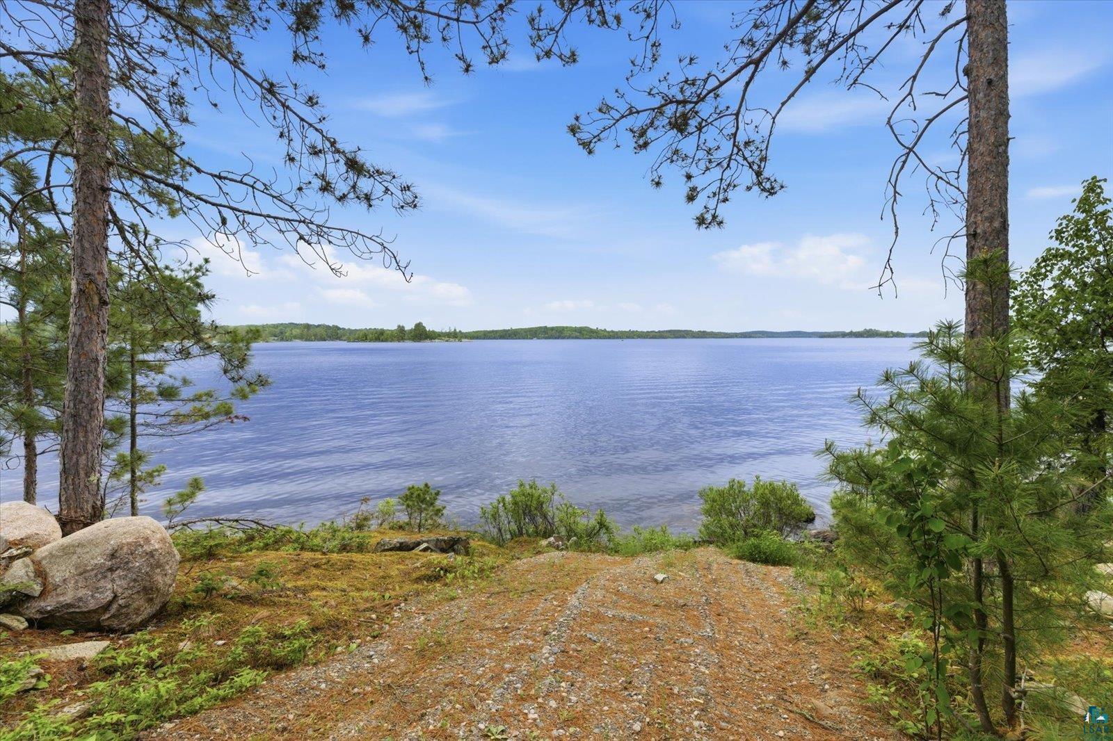 5298 Long Island Tower, MN 55790 - Photo 4 of 31 Expansive waterfront offering a natural shoreline, mature trees, and a clear blue sky