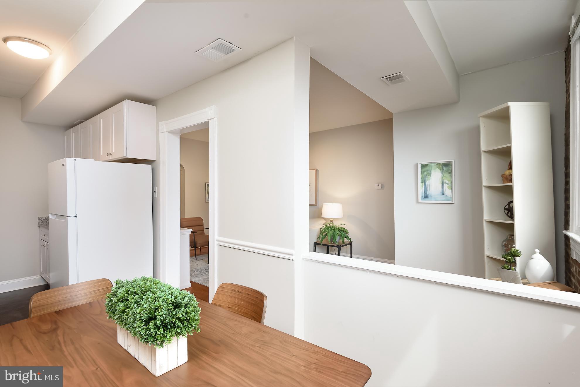 115 D Street Southeast, Unit 202 Washington, DC 20003 - Photo 11 of 17 Pass through from dining area to living room