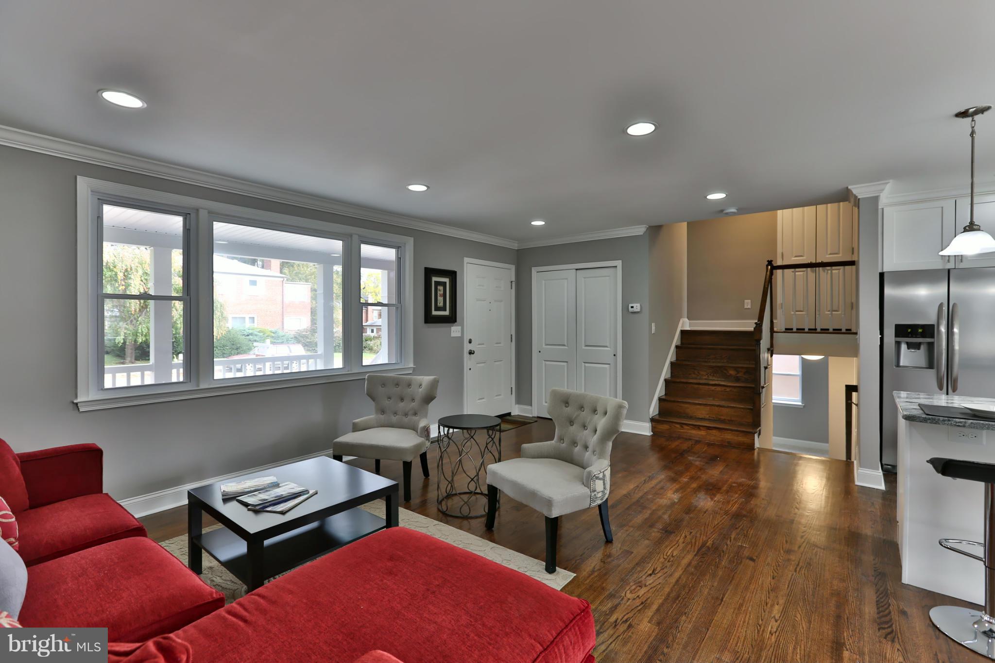 203 Hollen Road Baltimore, MD 21212 - Photo 3 of 30 a living room with furniture and wooden floor