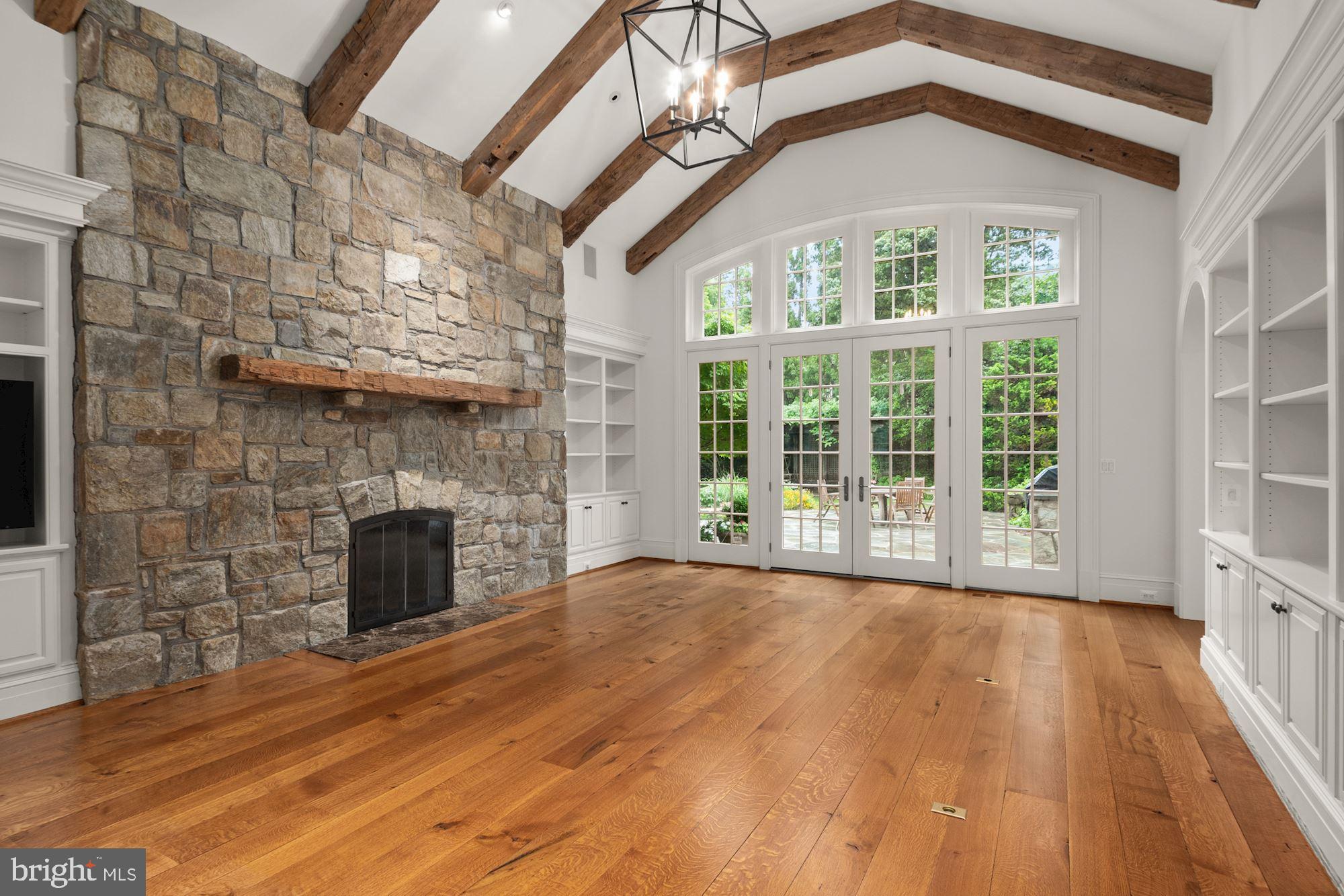 1107 Harvey Road McLean, VA 22101 - Photo 11 of 47 a view of an empty room with wooden floor fireplace and a window