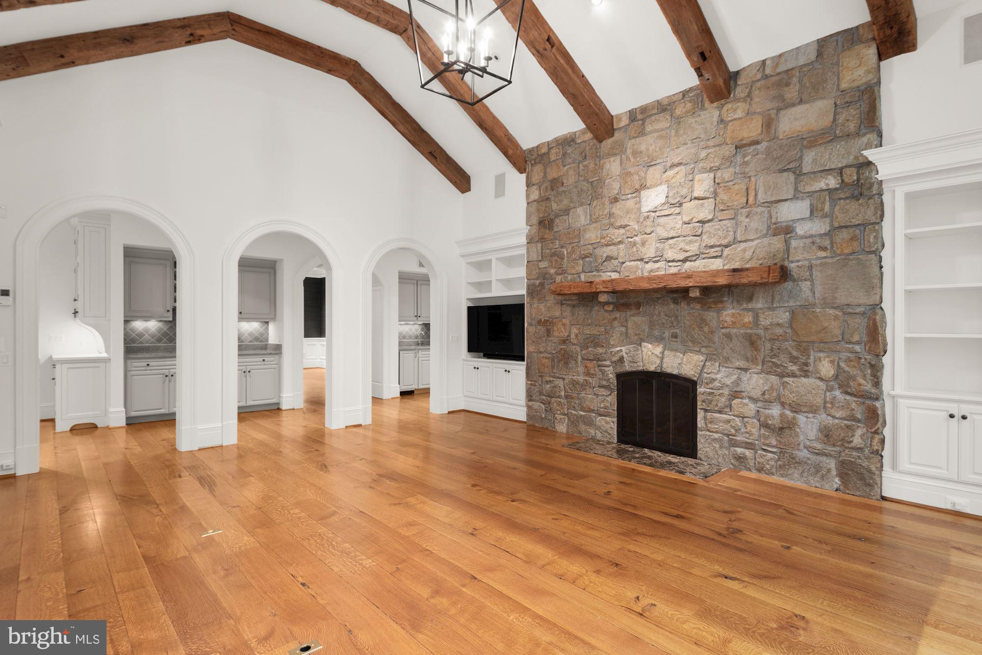 1107 Harvey Road McLean, VA 22101 - Photo 12 of 47 a view of empty room with wooden floor and fireplace