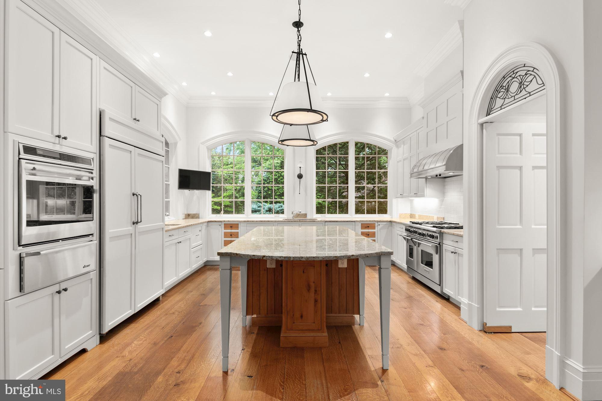 1107 Harvey Road McLean, VA 22101 - Photo 13 of 47 a kitchen with stainless steel appliances granite countertop a stove refrigerator and cabinets