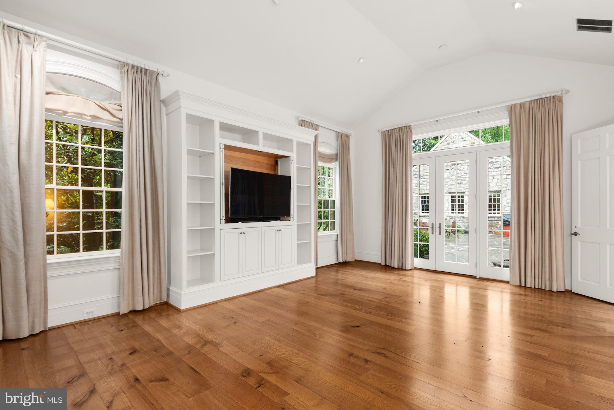 1107 Harvey Road McLean, VA 22101 - Photo 19 of 47 a view of an empty room with wooden floor and a window