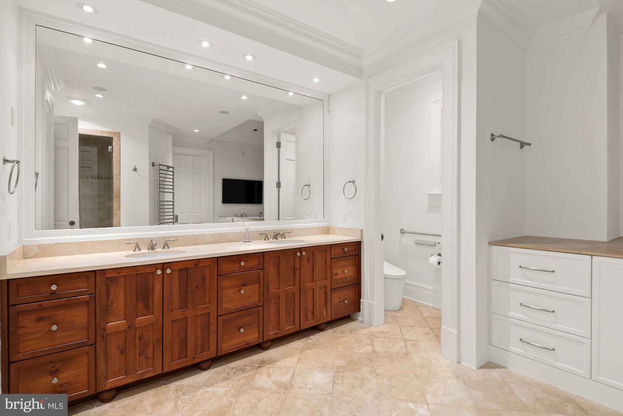 1107 Harvey Road McLean, VA 22101 - Photo 21 of 47 a spacious bathroom with a granite countertop sink mirror and double