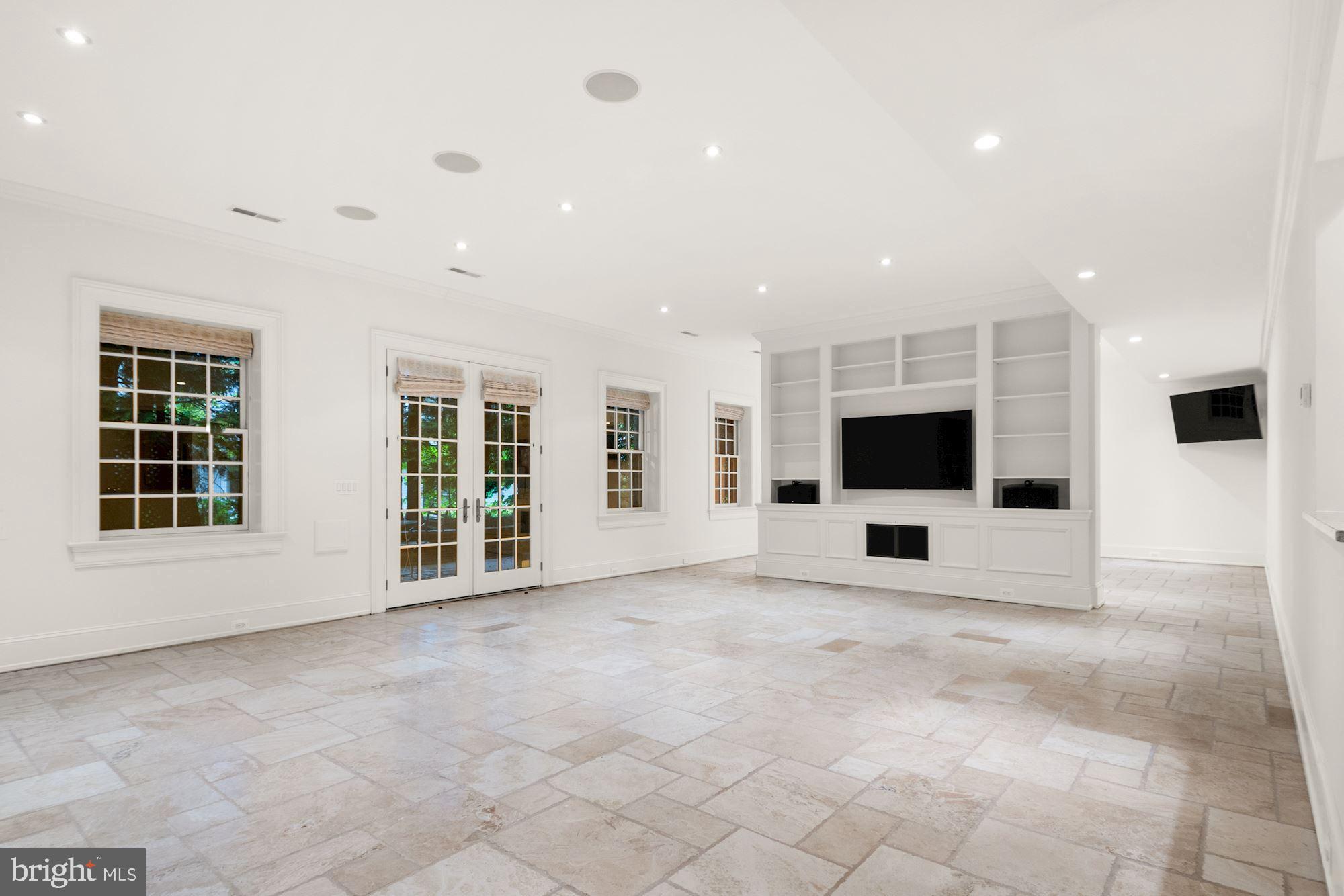 1107 Harvey Road McLean, VA 22101 - Photo 35 of 47 a view of an empty room with a fireplace and a large window
