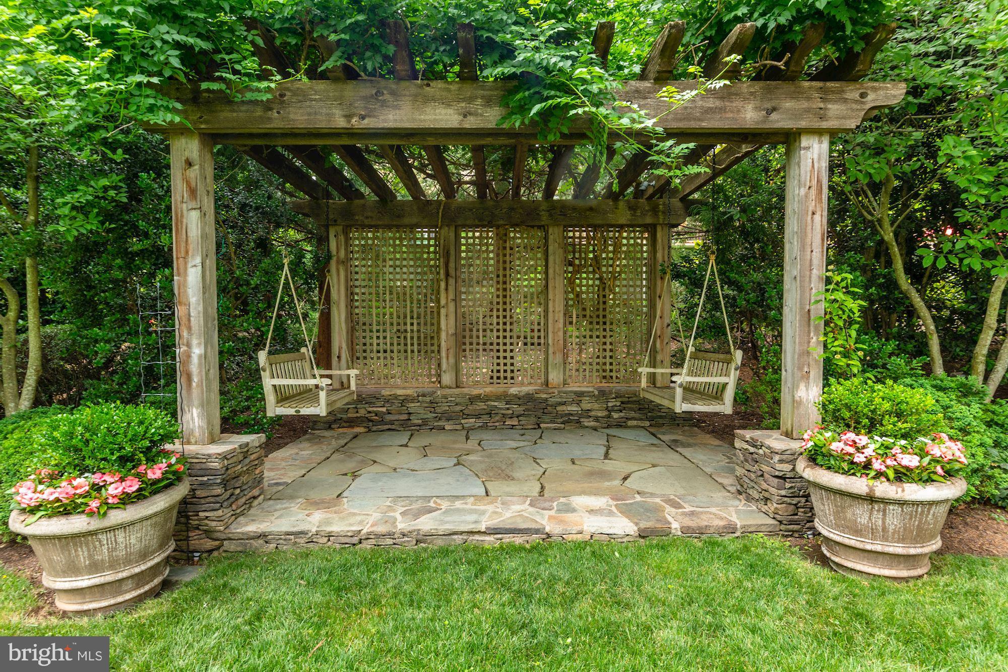 1107 Harvey Road McLean, VA 22101 - Photo 45 of 47 a view of a backyard with plants and garden