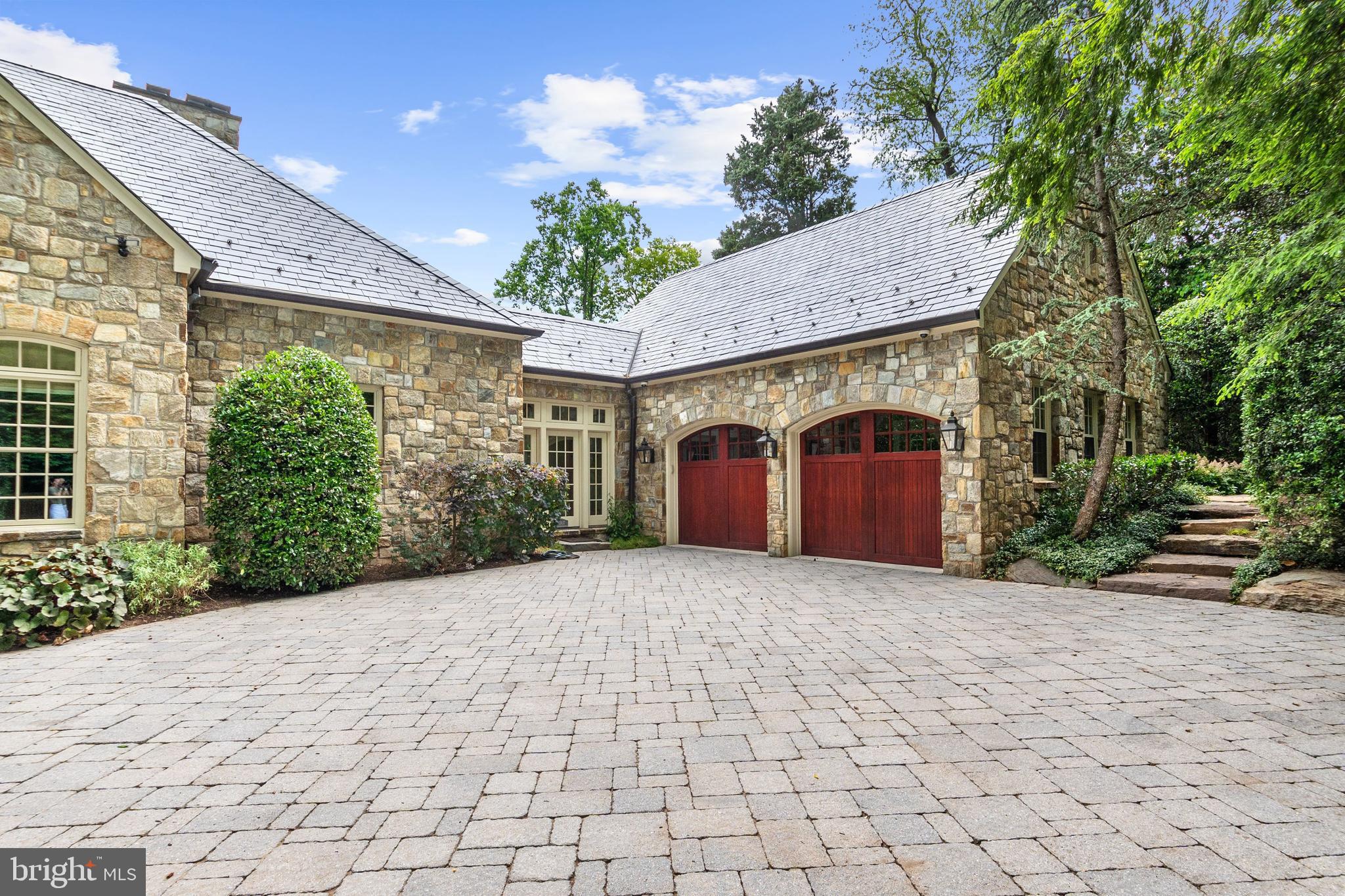 1107 Harvey Road McLean, VA 22101 - Photo 47 of 47 a front view of a house with a yard and garage