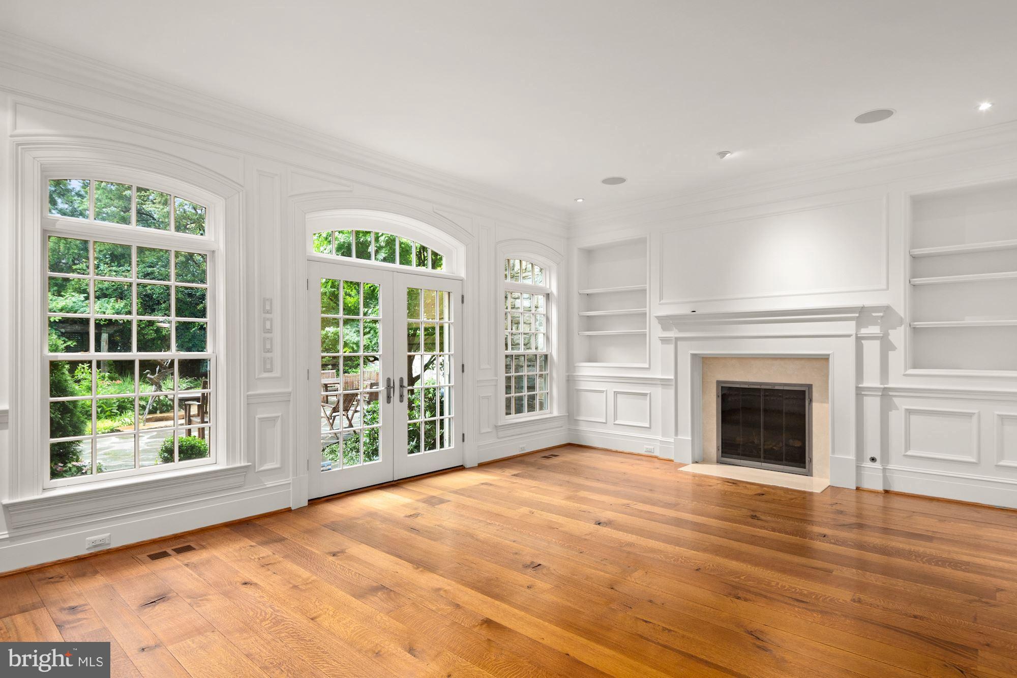 1107 Harvey Road McLean, VA 22101 - Photo 9 of 47 a view of an empty room with wooden floor and a window