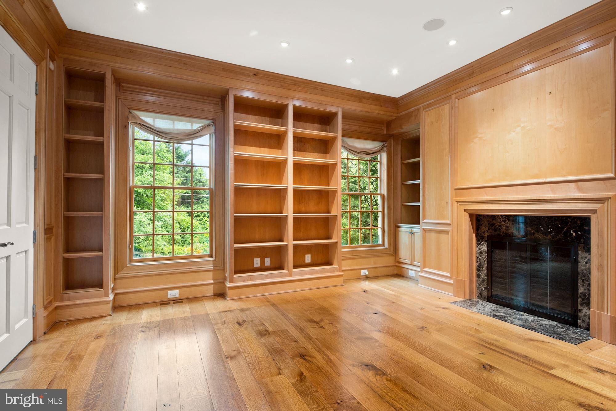 1107 Harvey Road McLean, VA 22101 - Photo 10 of 47 a view of an empty room with a fireplace and a window