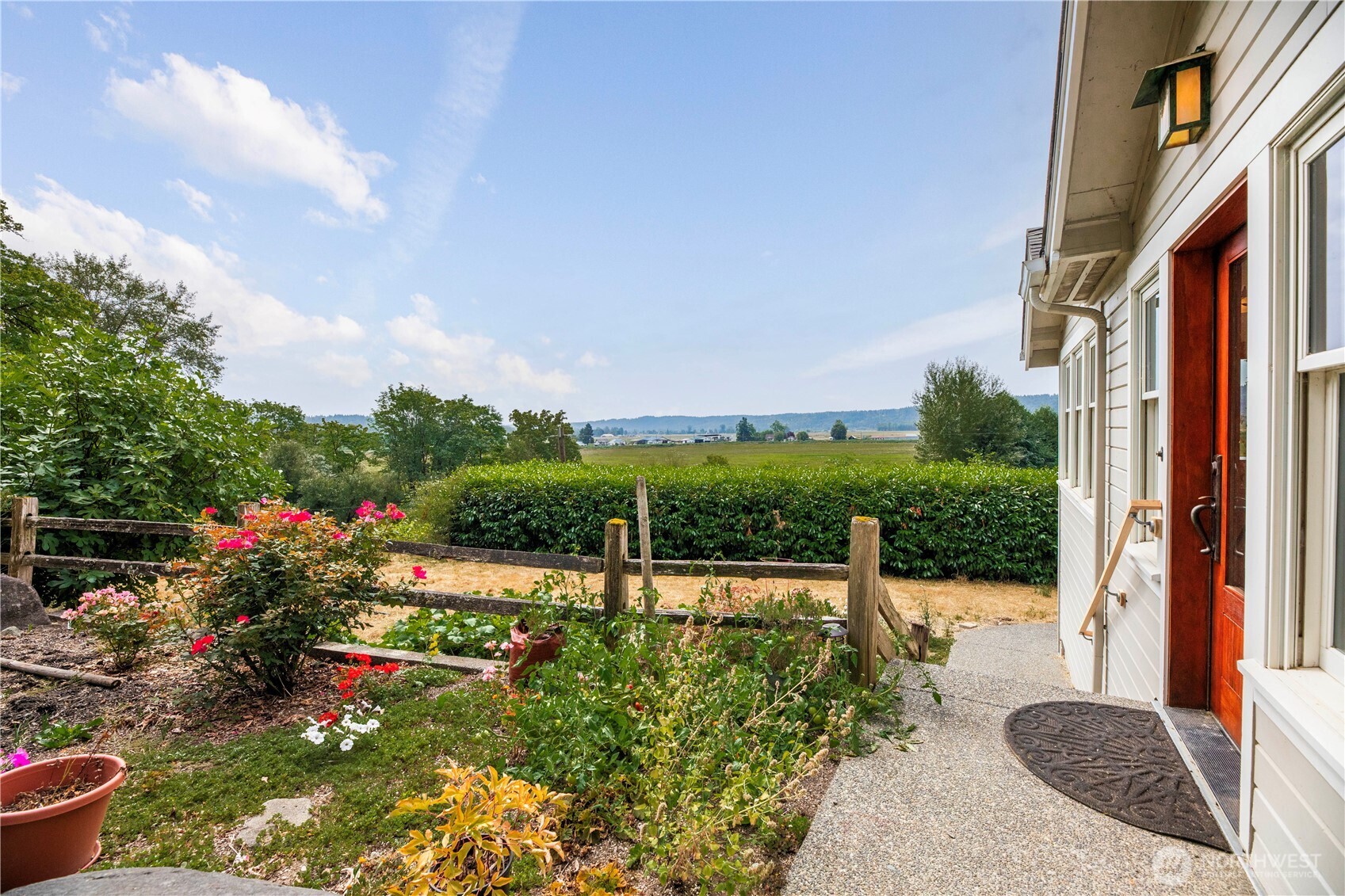 20226 Duvall Monroe Road Northeast Duvall, WA 98019 - Photo 27 of 38 a view of a patio with table and chairs and potted plants