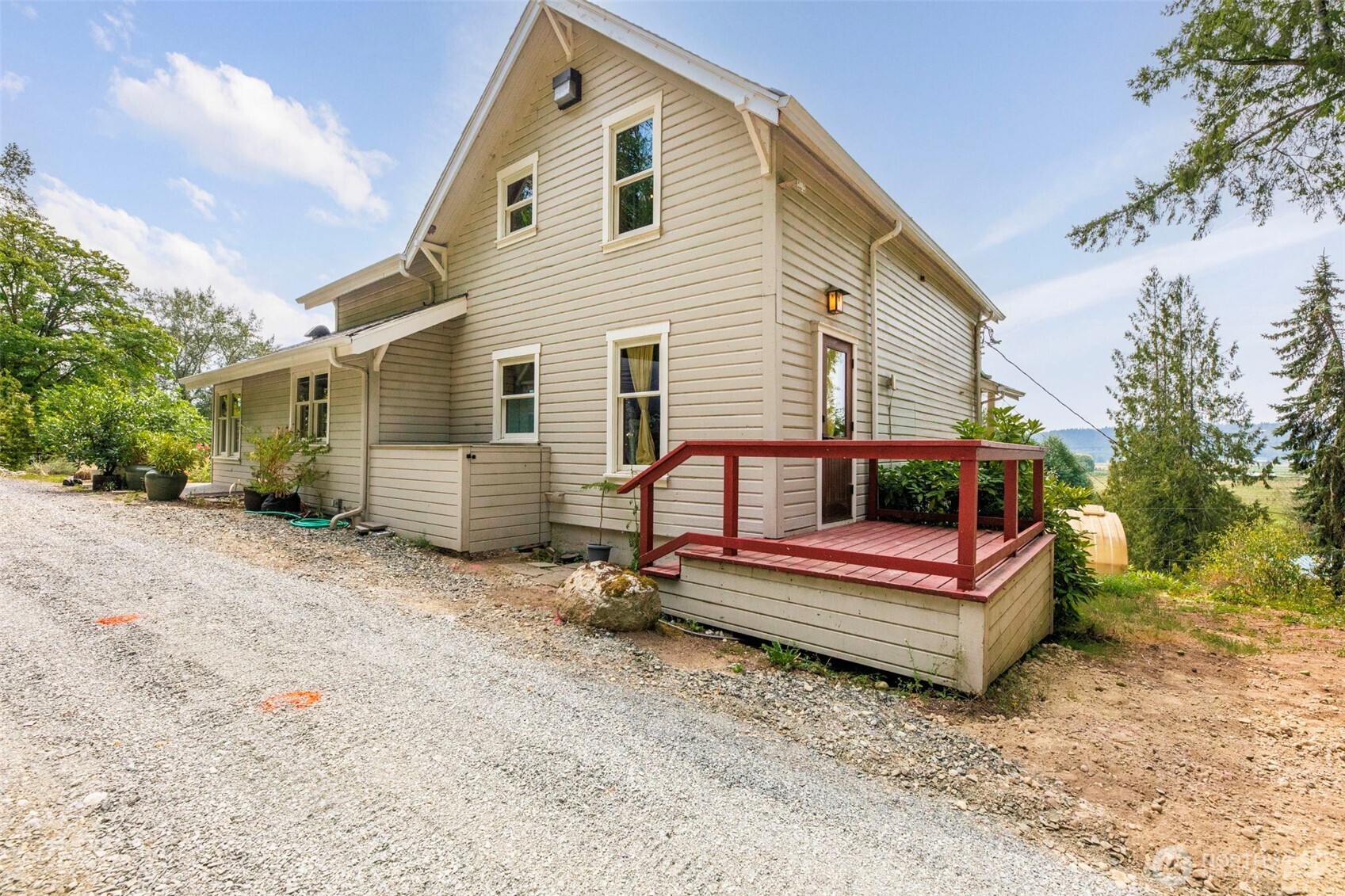 20226 Duvall Monroe Road Northeast Duvall, WA 98019 - Photo 31 of 38 a backyard of a house with barbeque oven and trees