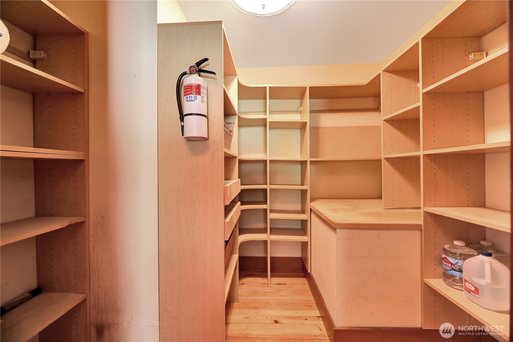 20226 Duvall Monroe Road Northeast Duvall, WA 98019 - Photo 9 of 38 a view of storage and utility room with empty racks