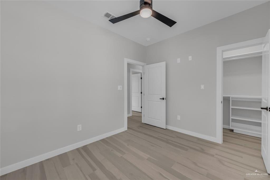 11509 North 25th Street, Unit C McAllen, TX 78504 - Photo 13 of 19 a view of an empty room and wooden floor