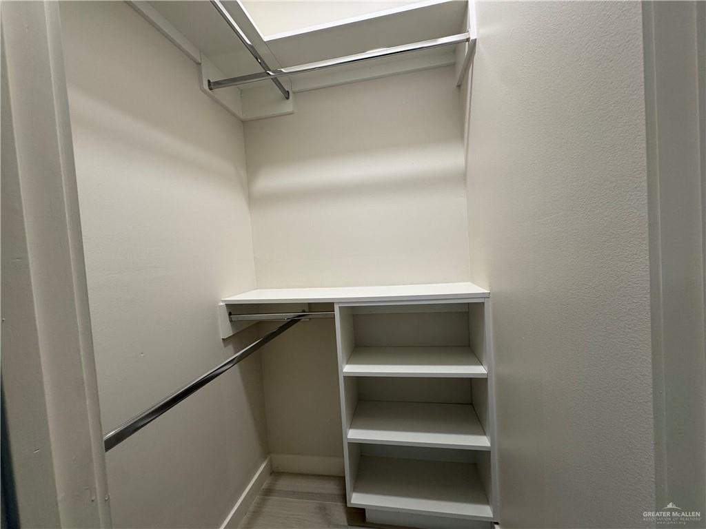 11509 North 25th Street, Unit C McAllen, TX 78504 - Photo 14 of 19 a view of walk in closet with empty racks