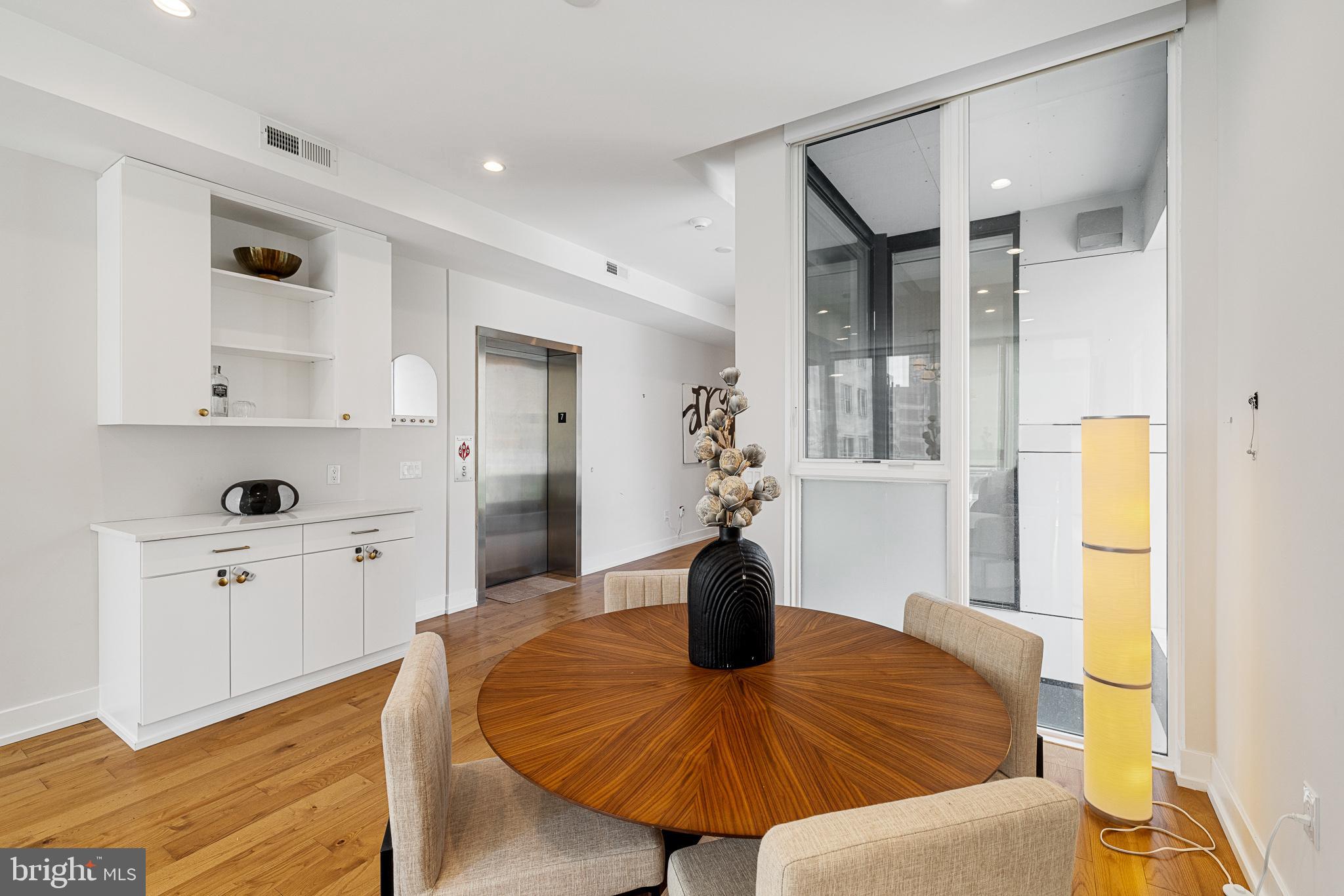 262 South 16th Street, Unit 7 Philadelphia, PA 19102 - Photo 11 of 36 a view of kitchen with furniture and wooden floor