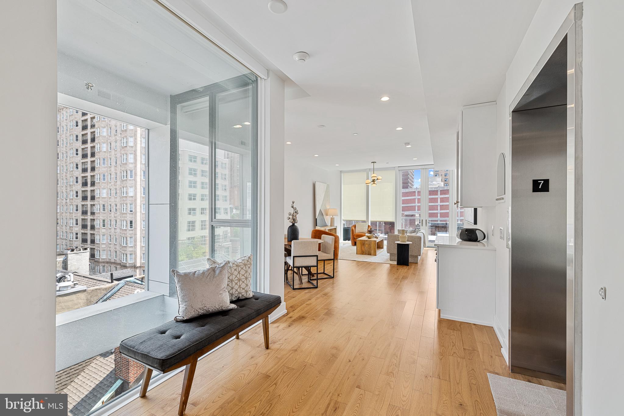 262 South 16th Street, Unit 7 Philadelphia, PA 19102 - Photo 12 of 36 a living room with furniture and a wooden floor