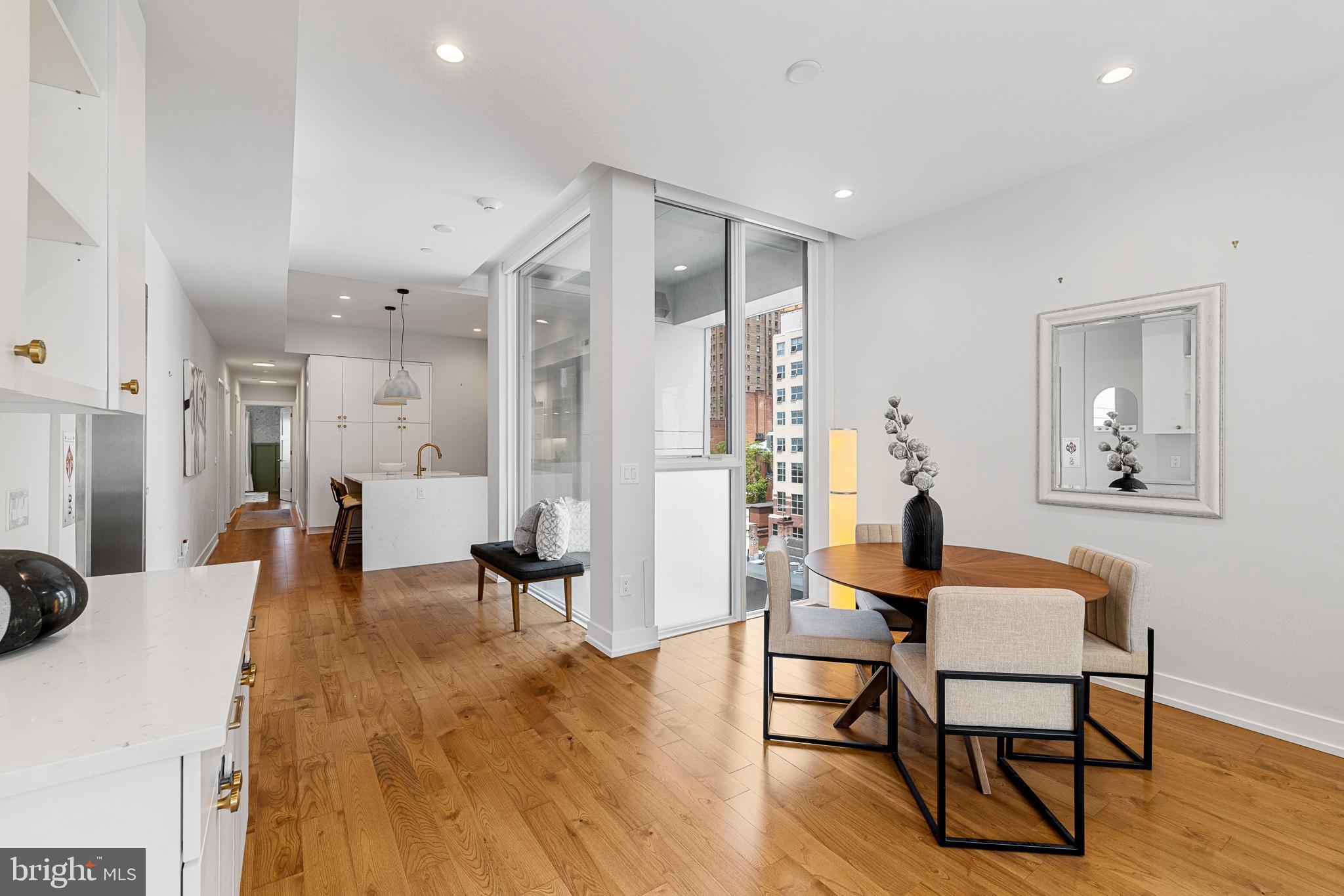 262 South 16th Street, Unit 7 Philadelphia, PA 19102 - Photo 13 of 36 a living room with furniture and a wooden floor