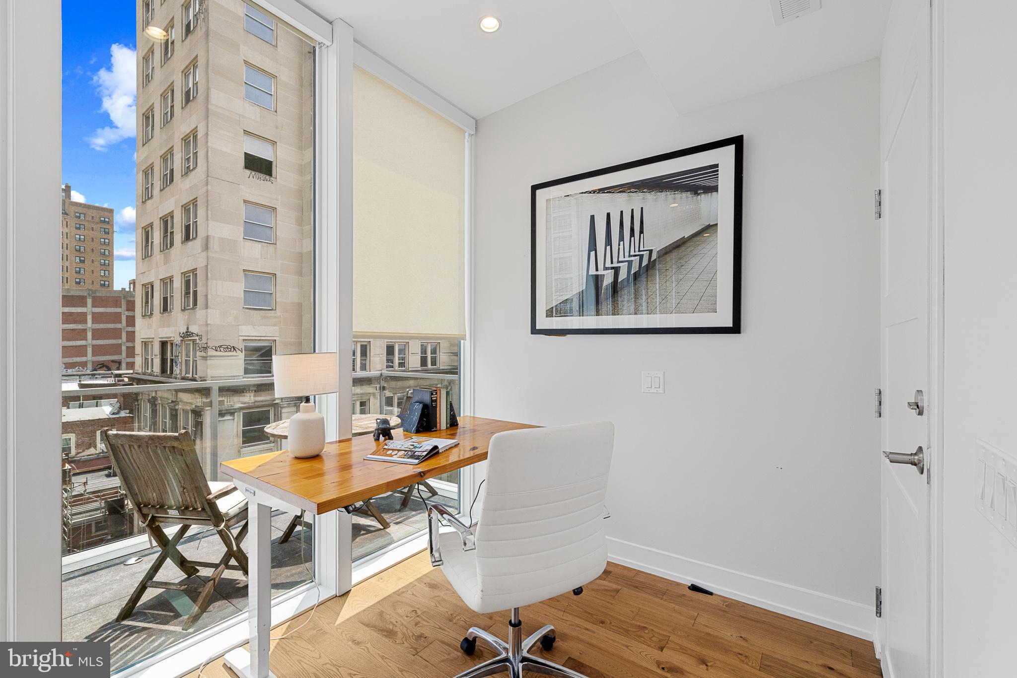 262 South 16th Street, Unit 7 Philadelphia, PA 19102 - Photo 14 of 36 a view of a workspace with furniture and a window