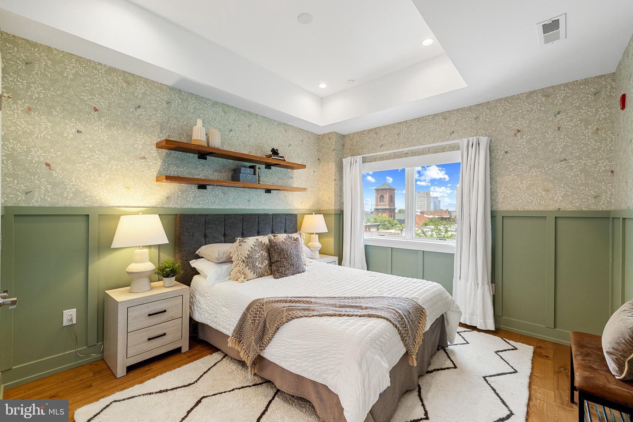 262 South 16th Street, Unit 7 Philadelphia, PA 19102 - Photo 16 of 36 a bedroom with a bed and a cabinets