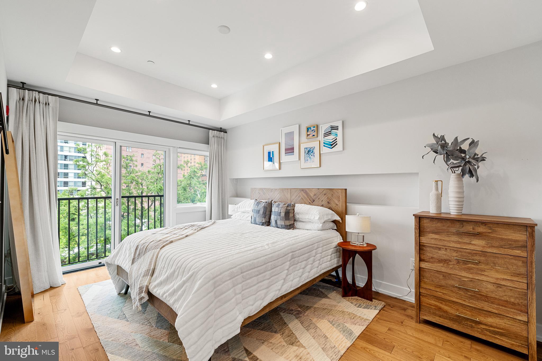 262 South 16th Street, Unit 7 Philadelphia, PA 19102 - Photo 19 of 36 a bedroom with a bed and a window