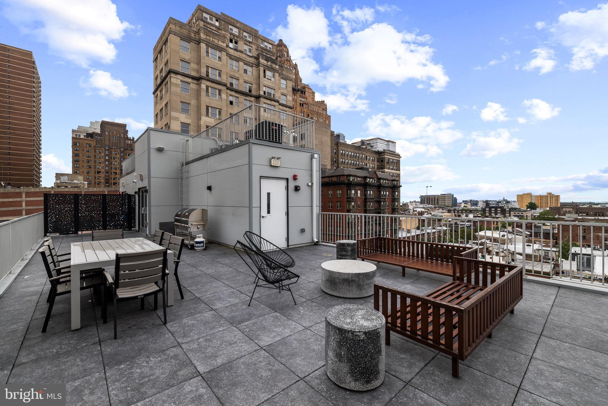 262 South 16th Street, Unit 7 Philadelphia, PA 19102 - Photo 33 of 36 a view of a roof deck with couches and potted plants