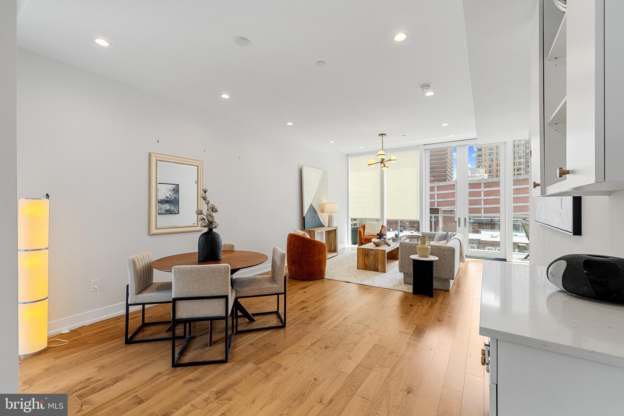 262 South 16th Street, Unit 7 Philadelphia, PA 19102 - Photo 10 of 36 a living room with furniture and a wooden floor