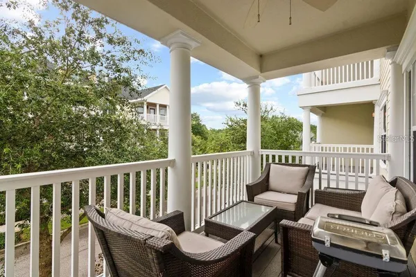 a view of a porch with furniture