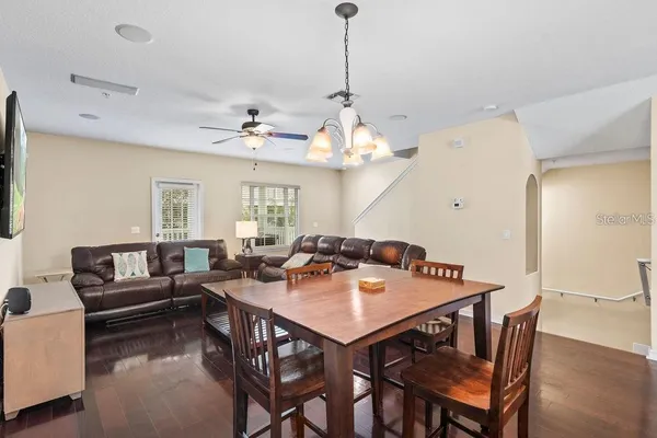 a view of a dining room with furniture and wooden floor