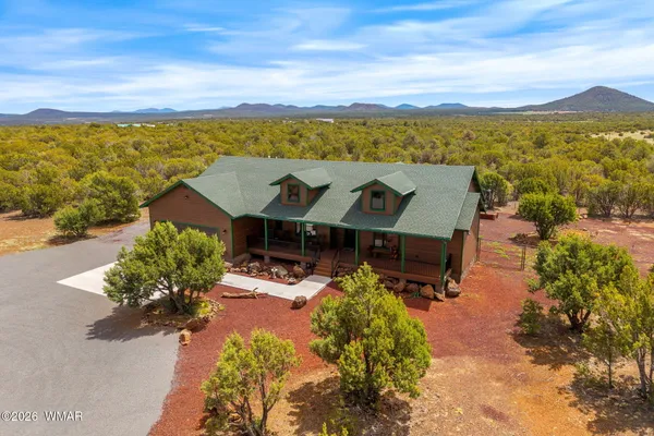 an aerial view of a house with a garden