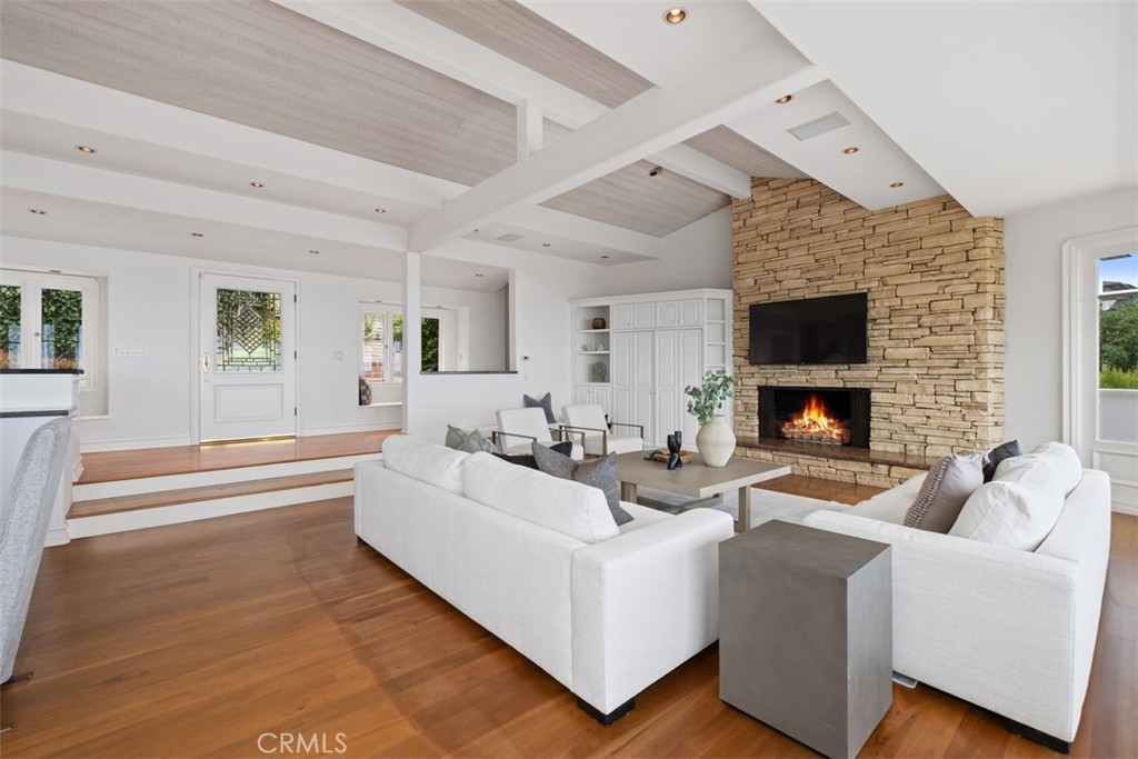 1201 Emerald Bay Laguna Beach, CA 92651 - Photo 12 of 47 a living room with furniture a fireplace and a flat screen tv
