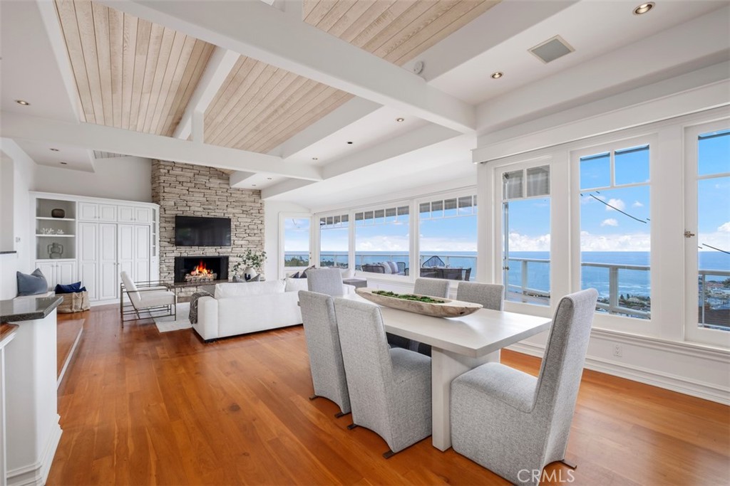 1201 Emerald Bay Laguna Beach, CA 92651 - Photo 15 of 47 a view of dining room kitchen with stainless steel appliances wooden floor and large window