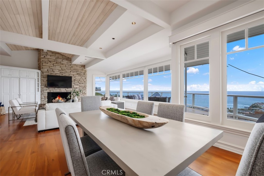 1201 Emerald Bay Laguna Beach, CA 92651 - Photo 16 of 47 a living room with stainless steel appliances furniture a fireplace and a flat screen tv