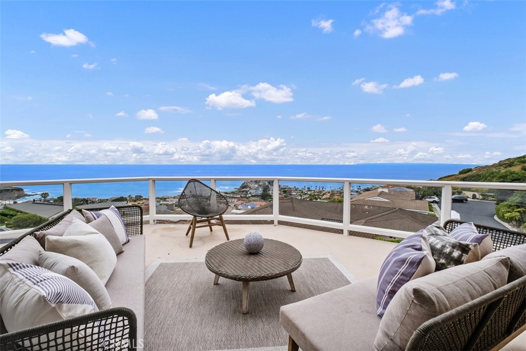 1201 Emerald Bay Laguna Beach, CA 92651 - Photo 24 of 47 a balcony with furniture and city view