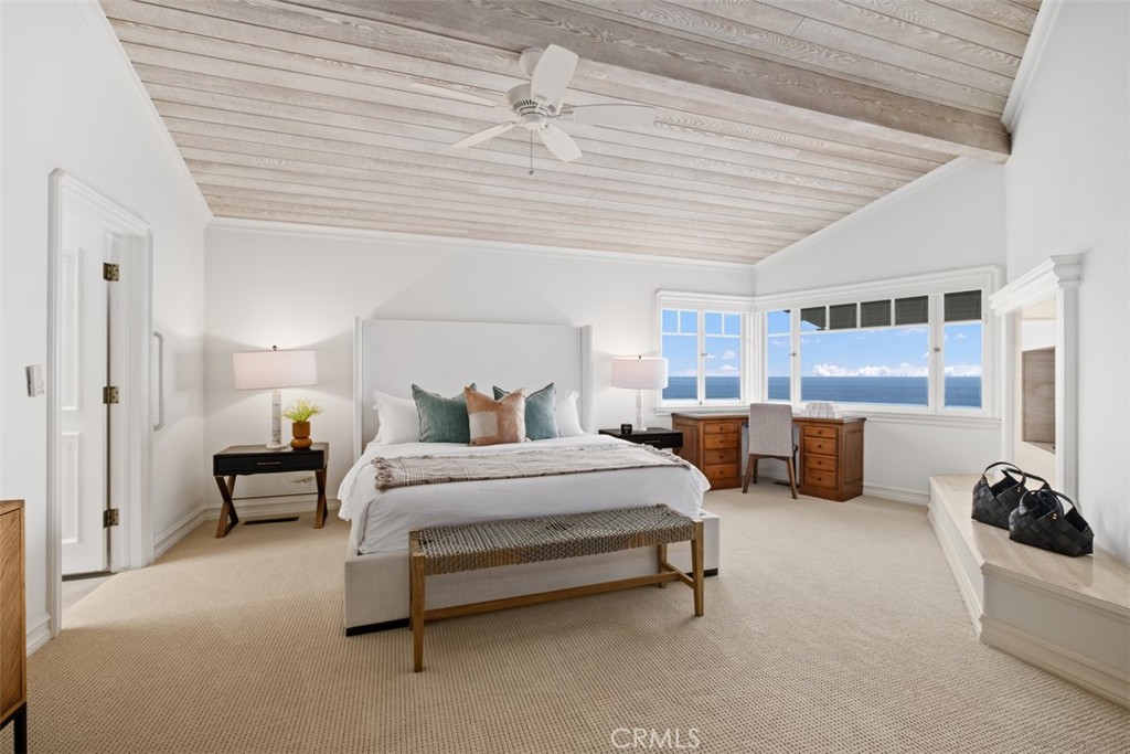 1201 Emerald Bay Laguna Beach, CA 92651 - Photo 29 of 47 a spacious bedroom with a bed and a couch