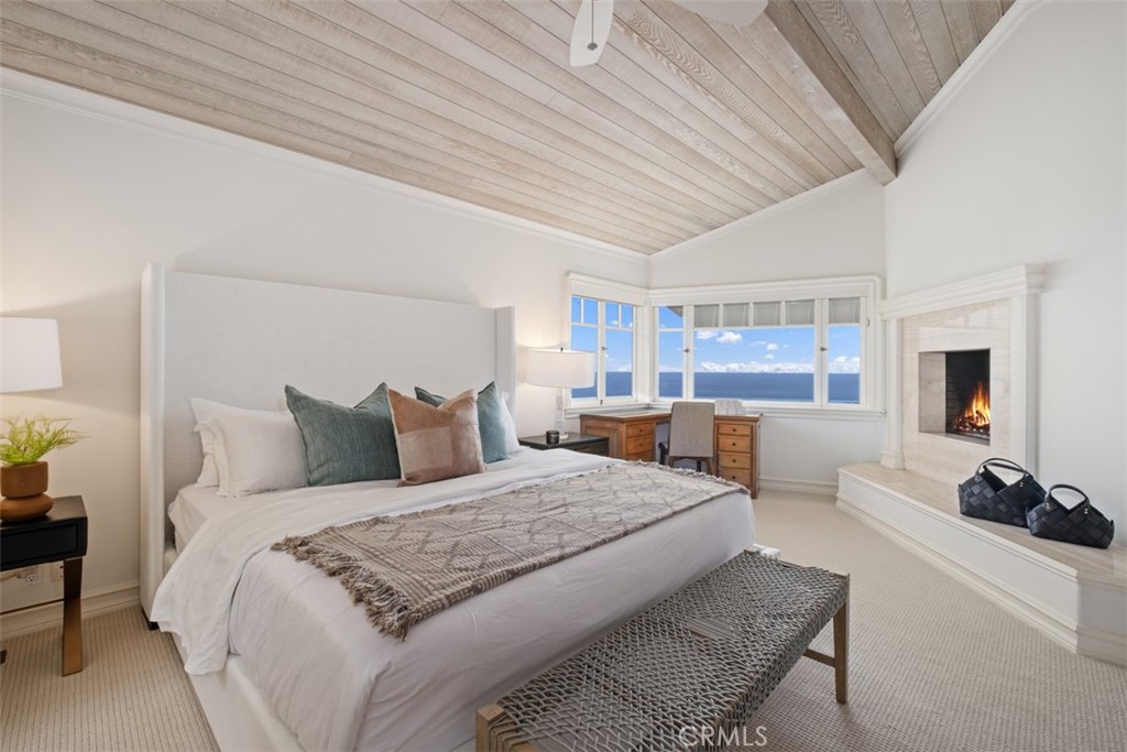 1201 Emerald Bay Laguna Beach, CA 92651 - Photo 30 of 47 a bedroom with a large bed and a view of kitchen