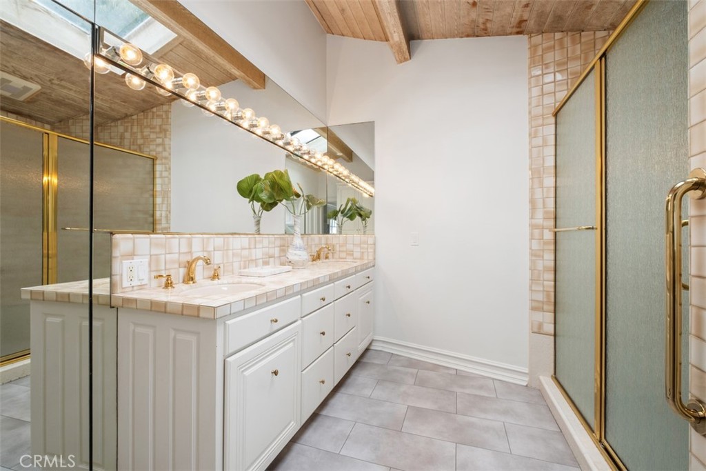 1201 Emerald Bay Laguna Beach, CA 92651 - Photo 34 of 47 a bathroom with a sink and a mirror