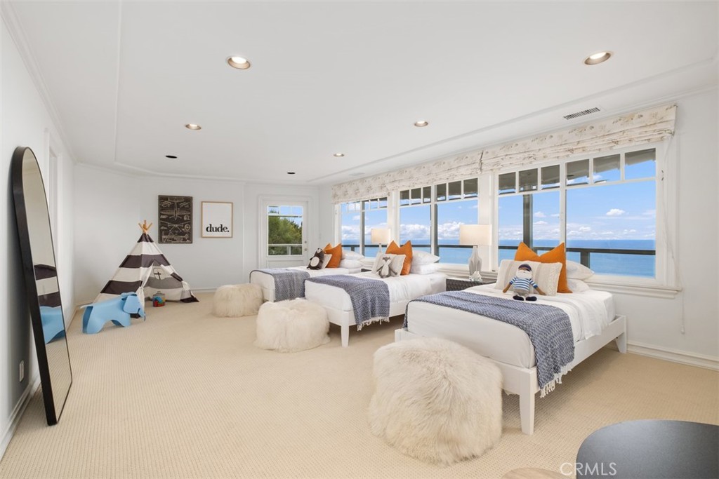 1201 Emerald Bay Laguna Beach, CA 92651 - Photo 38 of 47 a bed room with bed and a large window